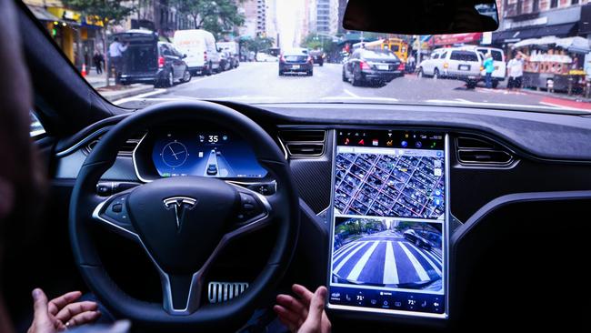 Look, no hands ... a General Motors expert says Tesla cars are not ready for fully autonomous capability. PHOTO: CHRISTOPHER GOODNEY/BLOOMBERG NEWS.