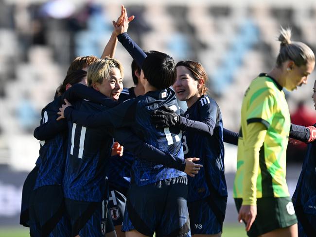 Japanese players celebrate one of their four goals. Picture: Jack Gorman/Getty Images