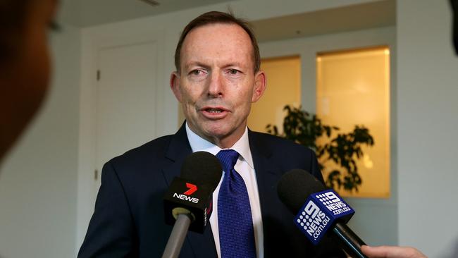 Tony Abbott arrives for a business leaders meeting with Coalition backbenchers about the National Energy Guarantee at Parliament House in Canberra.