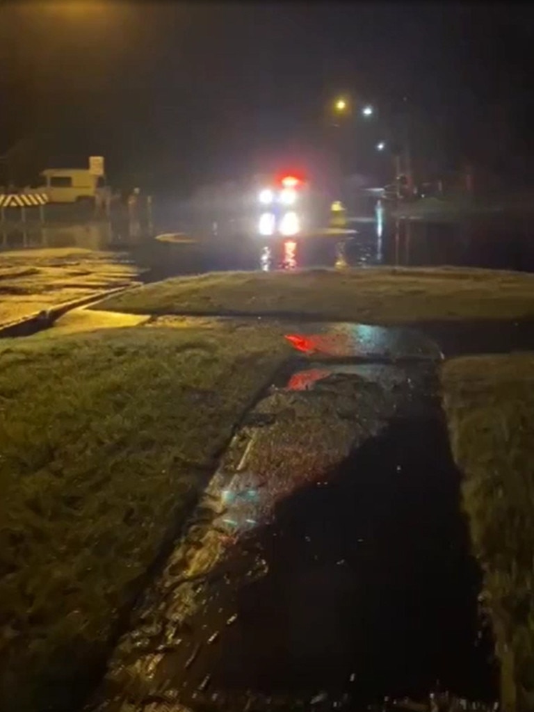 Oil and diesel are mixed in with floodwaters over roads around Kurnell. Picture: 2GB