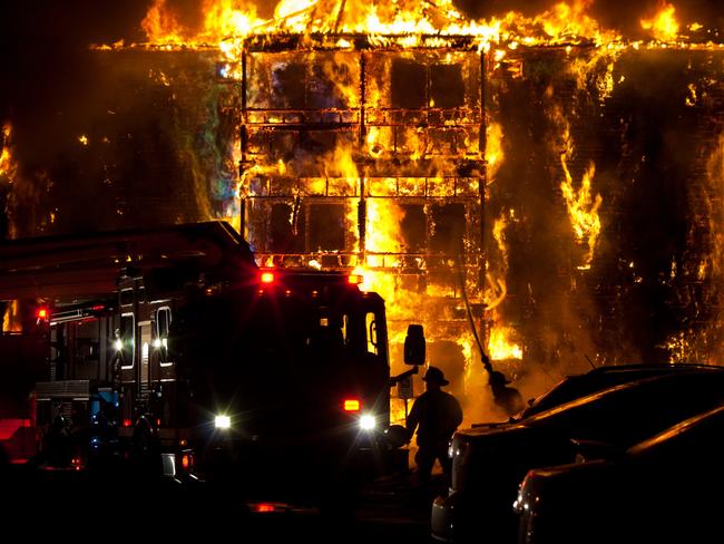 Image of an intense structure fire. Firefighters work hard to douse the flames. Useful image for any fire prevention theme.Picture: iStock