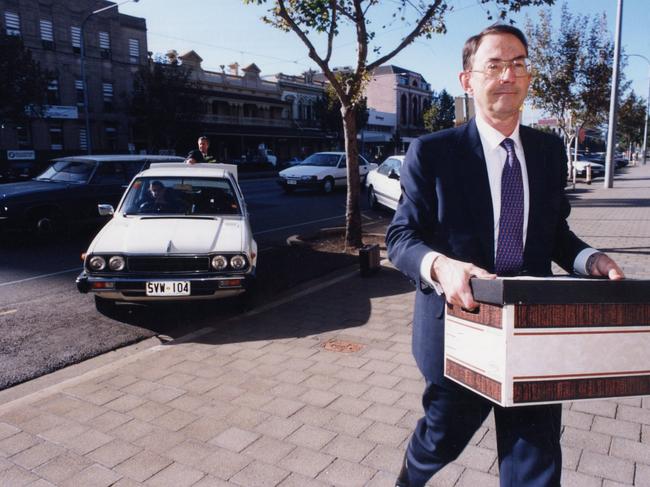 Former State Bank managing director Tim Marcus Clark carries a box of documents into the Supreme Court in 1996 to defend court against by the State Government and SA Asset Management Corporation.