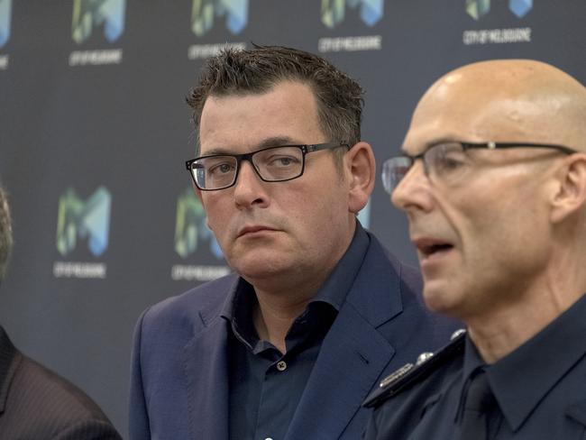 Victorian Premier Daniel Andrews with Victorian Police Deputy Commissioner Andrew Crisp. Picture: AAP Image/Luis Enrique Ascui