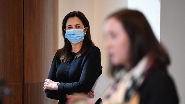 Queensland Premier Annastacia Palaszczuk watches Health Minister Yvette D'Ath during a Covid press conference on Wednesday. Picture: Dan Peled