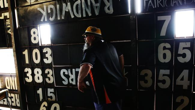 Big Bazz inside the scoreboard. Pictures: Brett Costello