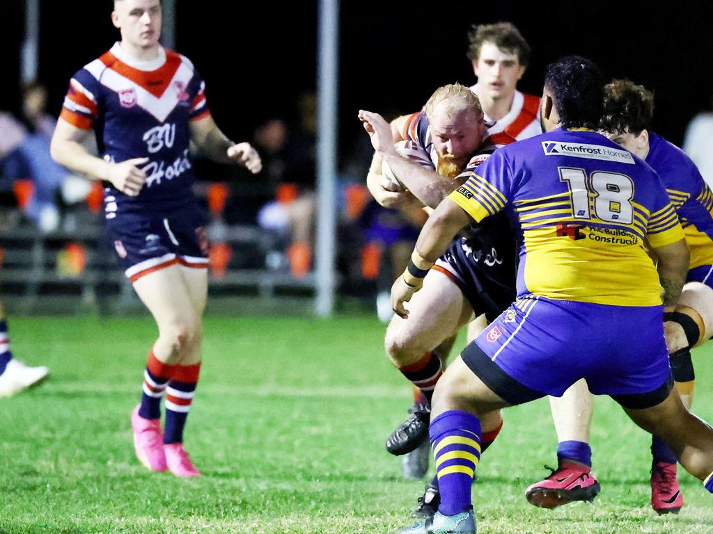 Roosters' Matty Baillie takes a hit up in the Far North Queensland Rugby League (FNQRL) Men's minor semi final match between the Atherton Roosters and the Cairns Kangaroos, held at Smithfield Sporting Complex. Picture: Brendan Radke