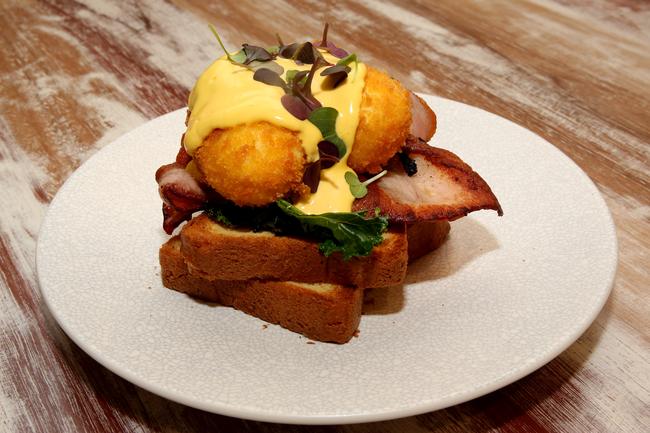 Golden eggs benedict at Espresso Warriors Cabramatta. Pictures: Joe Murphy