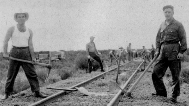 Italian migrants working on a section of the Trans-Australian railway line in the West Australian desert in 1955. Picture: "Migrants or Mates ... Italian life in Australia" by Gianfranco Cresciani