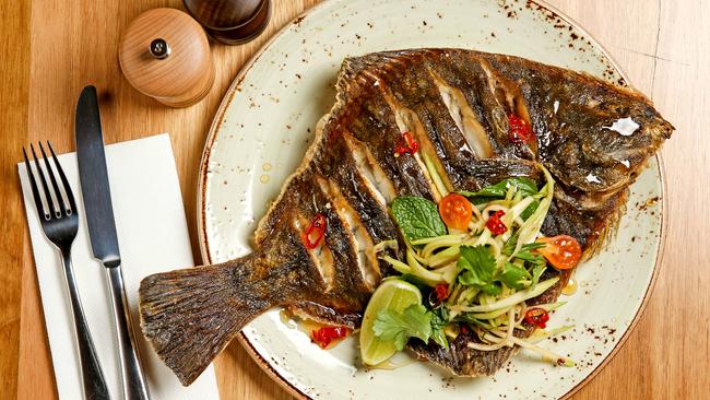 Whole flounder with green papaya salad. Picture: Tim Carrafa