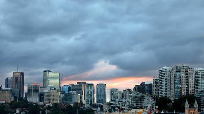 SYDNEY, AUSTRALIA - NewsWire Photos AUGUST 3, 2021: Rain clouds pictured as the sun rises in North Sydney during Lockdown. Picture: NCA NewsWire / Damian Shaw