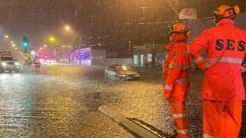 Emergency services personnel, including SES volunteers, had to rescue a driver from their small car after they tried to drive through floodwater across Pittwater Rd at Narrabeen, near Robertson Street, early on Tuesday after torrential rain swept across the northern beaches on Monday night and Tuesday morning. Picture: SES Warringah/Pittwater