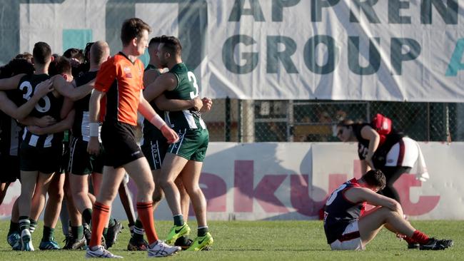 Airport West celebrates its victory in Saturday’s remarkable grand final. Picture: Mark Dadswell