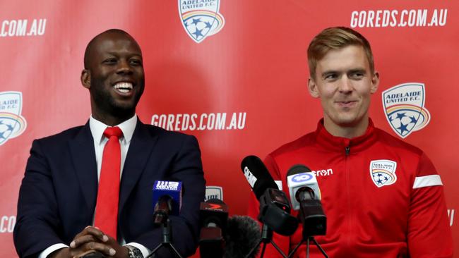 Adelaide United director of football Bruce Djite (left) announces the signing of Norwegian striker Kristian Opseth on July 31, 2019. Picture: AAP Image/Kelly Barnes