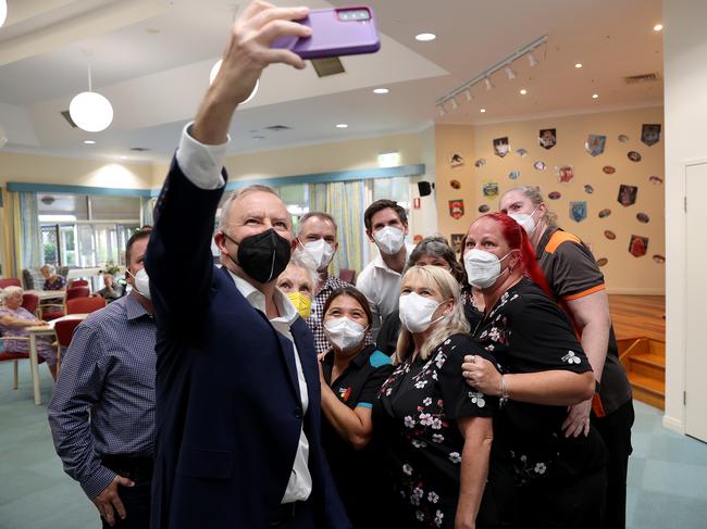 Labor leader Anthony Albanese with partner Jodie Haydon and staff at Bolton Clarke Fairways Retirement Living and Residential Aged Care in Bundaberg, Queensland on Good Friday. Picture: Toby Zerna