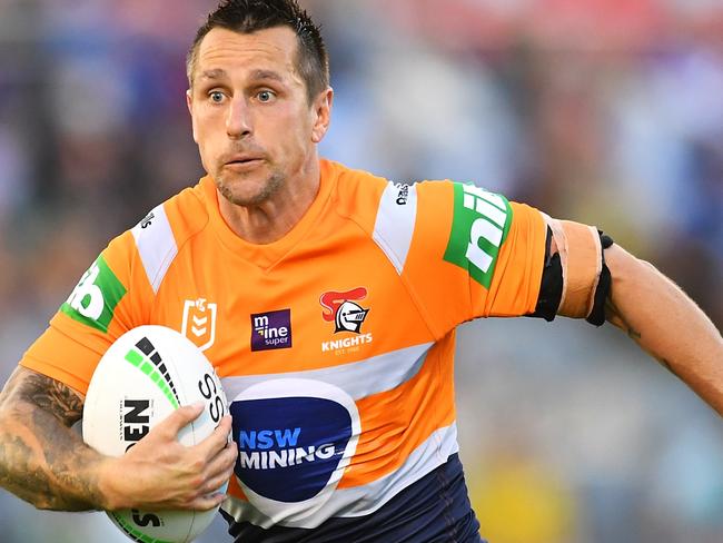 BRISBANE, AUSTRALIA - AUGUST 15:  Mitchell Pearce of the Knights runs the ball during the round 22 NRL match between the Cronulla Sharks and the Newcastle Knights at Moreton Daily Stadium, on August 15, 2021, in Brisbane, Australia. (Photo by Albert Perez/Getty Images)