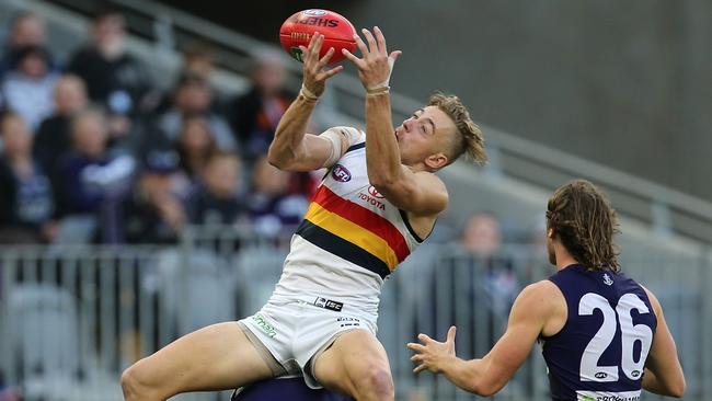 Hugh Greenwood flies for a mark. Picture: Getty Images