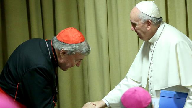 Pope Francis greets Australian Cardinal George Pell in 2015 in Vatican City. Photo by Franco Origlia/Getty Images