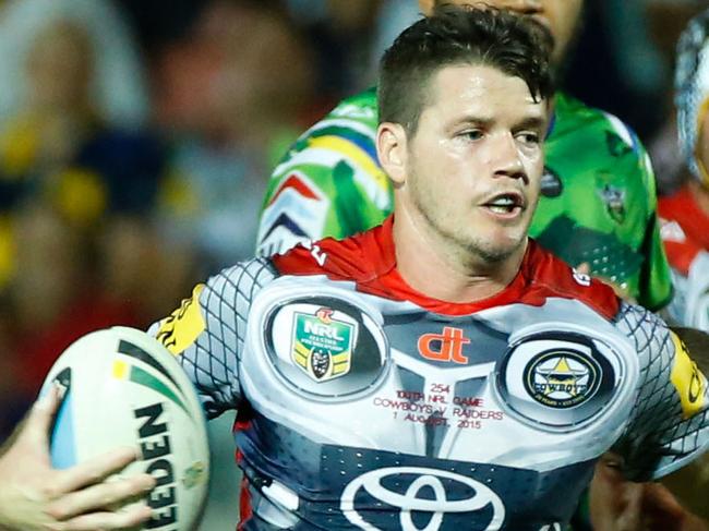 North Queensland Cowboys' Lachlan Coote is tackled during their round 21 NRL match against the Canberra Raiders at 1300 Smiles Stadium, Townsville, Saturday, Aug. 1, 2015. (AAP Image/Michael Chambers) NO ARCHIVING, EDITORIAL USE ONLY