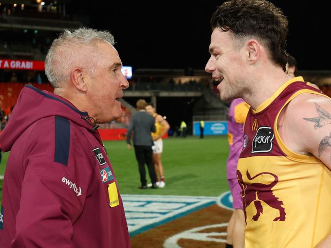 SYDNEY, AUSTRALIA - SEPTEMBER 14: Lachie Neale of the Lions celebrates with Chris Fagan, Senior Coach of the Lions during the 2024 AFL First Semi Final match between the GWS GIANTS and the Brisbane Lions at ENGIE Stadium on September 14, 2024 in Sydney, Australia. (Photo by Dylan Burns/AFL Photos via Getty Images)