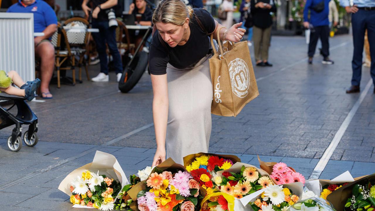 Floral tributes at Bondi Junction today after 6 people were killed in a massacre at Bondi Westfield yesterday afternoon. Picture: NCA NewsWire / David Swift