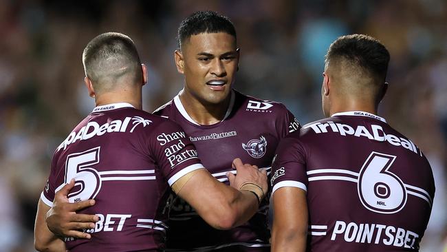 Haumole Olakau'atu of the Sea Eagles celebrates with teammates. Photo by Cameron Spencer/Getty Images.