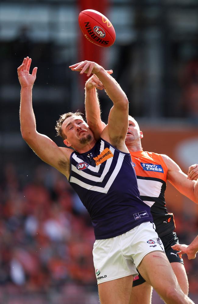 Brennan Cox contests the ball with Jesse Hogan in Sydney on Saturday. Picture: Brendon Thorne/AFL Photos/via Getty Images.