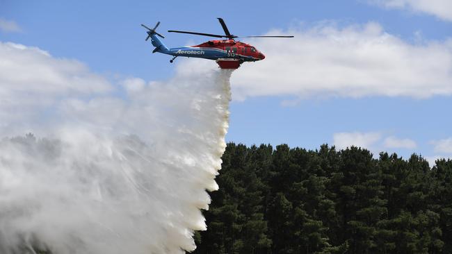 The new Sikorsky UH-60 Black Hawk dropping fire retardant. Picture: Tricia Watkinson