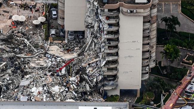 In this aerial view, search and rescue personnel work on site after the partial collapse of the Champlain Towers South in Surfside, north of Miami Beach.