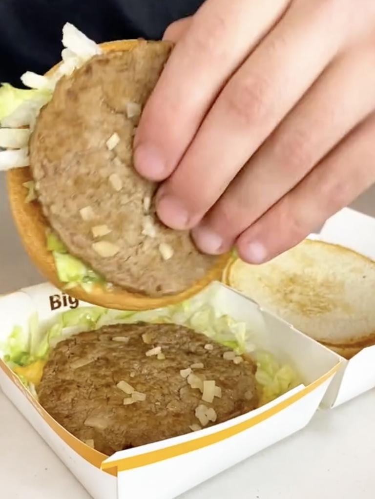 Then flip the middle of the burger so the second bun was on the outside. Picture: TikTok/Cake Mail.
