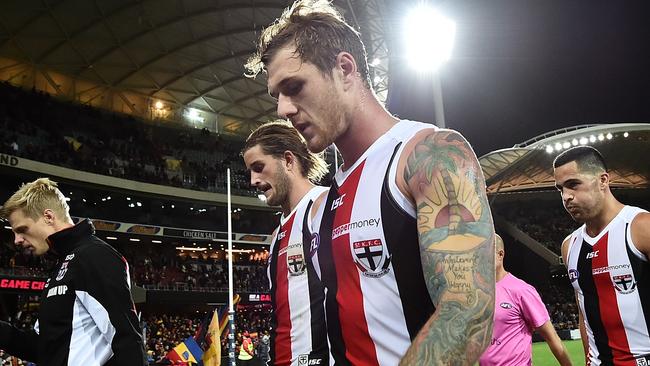 St Kilda players walk from the field. (Photo by Daniel Kalisz/Getty Images)