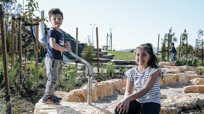 Joel and Elise enjoying the new playground at Weigall Oval in Plympton, which was completed in late 2018. Picture: Morgan Sette/AAP