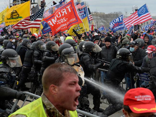 Trump supporters clash with police and security forces as people try to storm the US Capitol in Washington DC on January 6, 2021. Picture: AFP