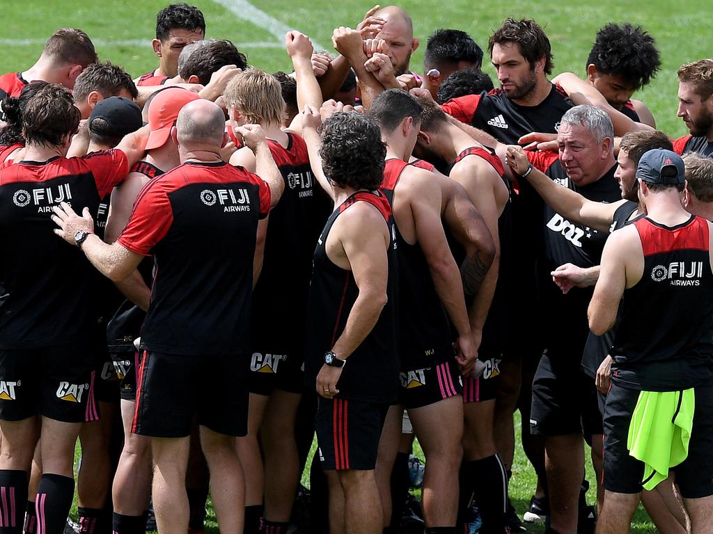 Canterbury Crusaders players and staff come together during their Captain's Run training session after observing two minute's silence, a week on from the Christchurch terror attack, at 11.32am Sydney time, at The Scots College, in Sydney, Friday, March 22, 2019. The Crusaders face the Waratahs at the SCG on Saturday. (AAP Image/Dan Himbrechts) NO ARCHIVING