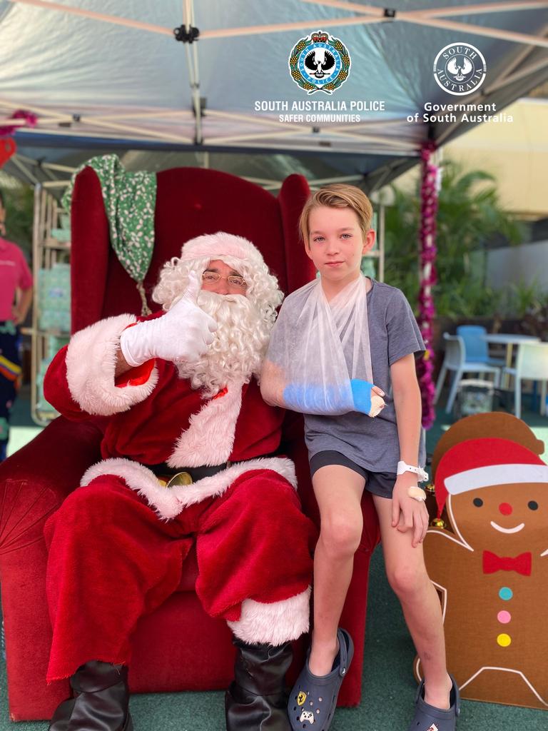 Santa Scutchings hearing Oliver’s Christmas wishes. Picture: SA Police