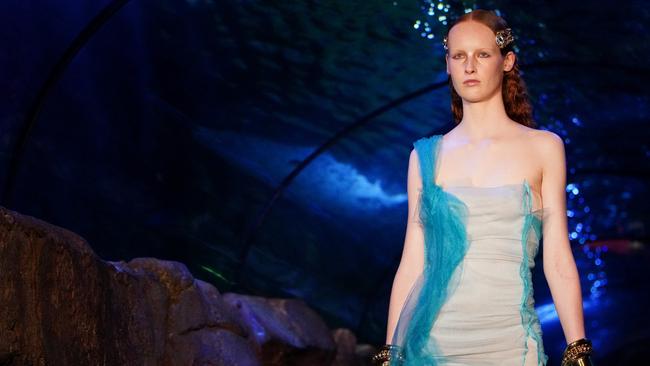 A model walks the underwater runway at Sydney Aquarium for the Speed show. Picture: Getty Images