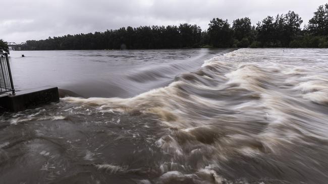 The Nepean River at the Penrith weir struggles to contain flooding on Saturday. Picture: Brook Mitchell/Getty Images