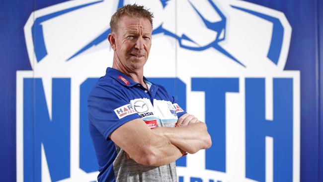 MELBOURNE, AUSTRALIA - FEBRUARY 08: David Noble, Senior Coach of the Kangaroos poses for a photograph during the North Melbourne 2021 Official Team Photo Day at Arden Street Oval on February 08, 2021 in Melbourne, Australia. (Photo by Dylan Burns/AFL Photos via Getty Images)