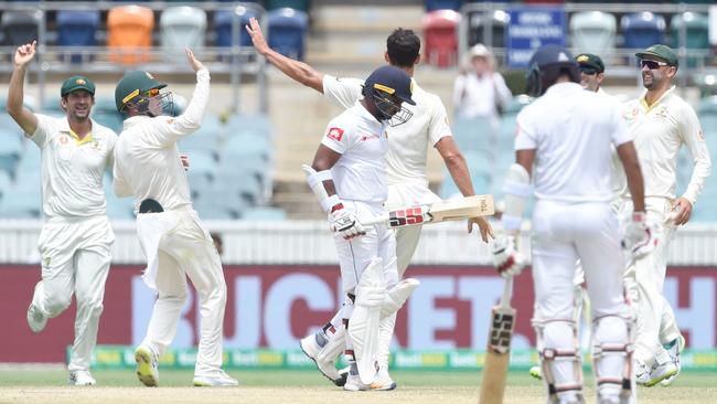 Perera was dismissed first ball in the second innings after defying doctor’s orders to bat. (Photo by ISHARA S. KODIKARA / AFP) 