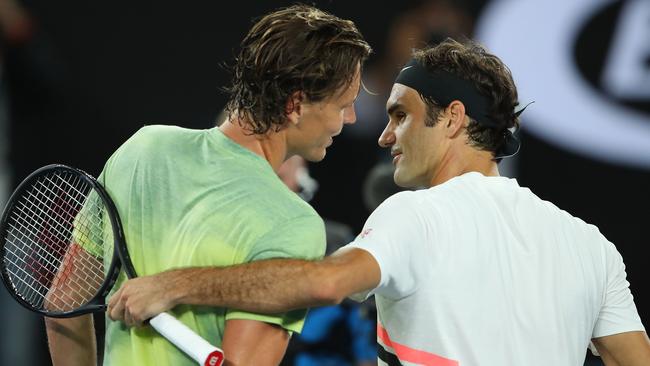 Tomas Berdych congratulates Roger Federer. (Photo by Mark Kolbe/Getty Images)