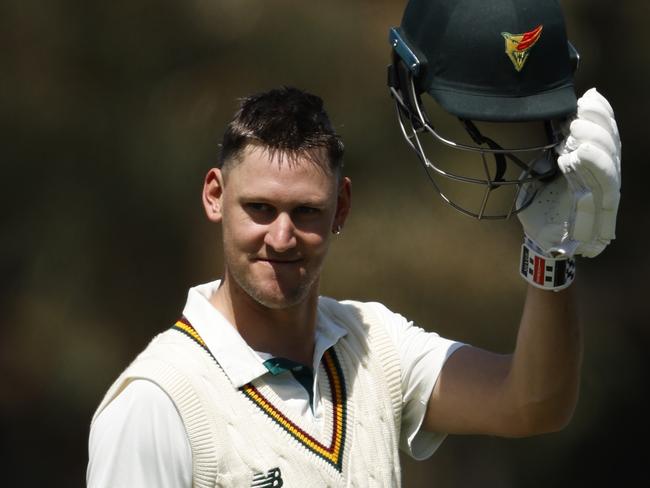 MELBOURNE, AUSTRALIA - OCTOBER 10: Beau Webster of Tasmania acknowledges his team mates after scoring 100 runs during the Sheffield Shield match between Victoria and Tasmania at CitiPower Centre, on October 10, 2024, in Melbourne, Australia. (Photo by Darrian Traynor/Getty Images)