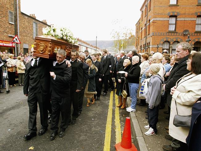 Remembered three decades after her death ... the sons of Jean McConville carry her remains, which were found in a shallow grave above a beach, at her 2003 funeral in 2003 in Belfast.