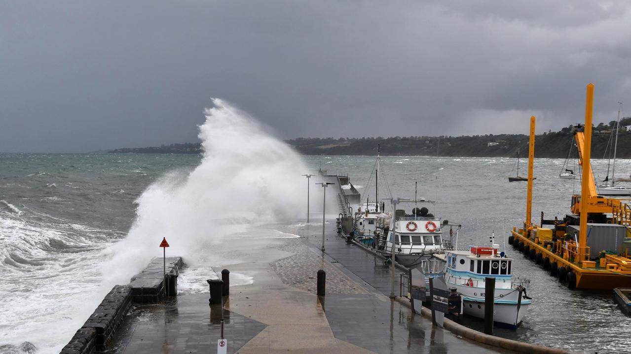 A big wave strikes Mornington Pier following this morning’s cold front. Picture: Adam Richmond