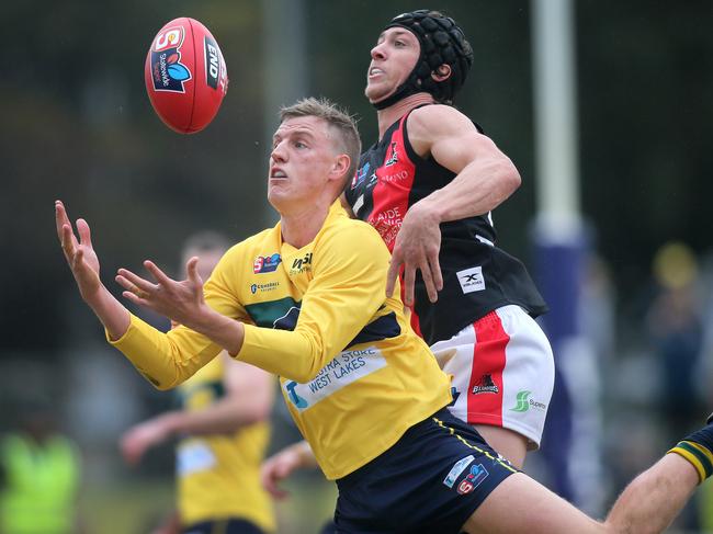 Eagles’ Nick Hayes marks in front of West Adelaide’s Mitch Duval. Picture Dean Martin