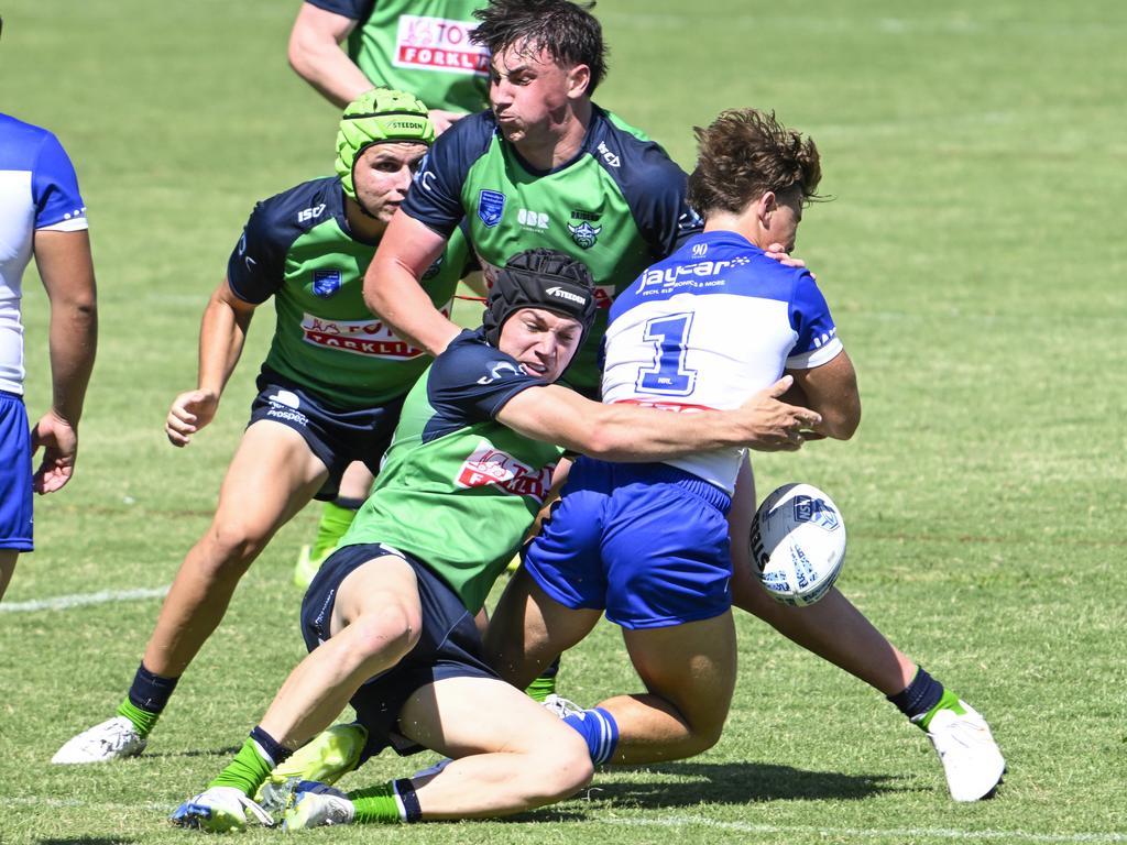 Hardy Glover puts a shot on Jai Callaghan. Picture: Martin Ollman