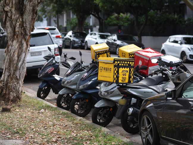 Scooters parked outside a house where 30 licence holders racked up thousands of points. Picture: Rohan Kelly