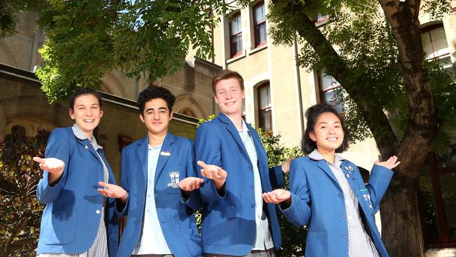 Mary Tomasiello, Joshua Parisot, Harrison Fell and Niesha Bernal in front of the previous location of the missing bell at Loyola Jesuit College. Picture: Hamish Blair