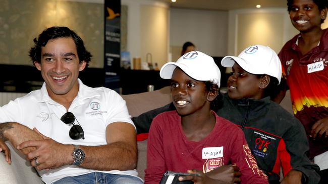 Johnathan Thurston with young members of the Johnathan Thurston Academy, Isaiah Yam, Chanteira David and Hamish Gilbert. Image: Anna Rogers