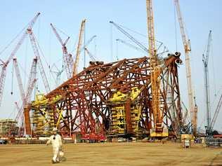 CHINA WATCH: Construction abounds at a subsidiary of China Offshore Oil Engineering Co Ltd in Qingdao, in eastern China's Shandong province.