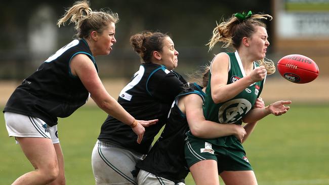 Greensborough Lauren Collis can’t escape three Laurimar tacklers. Picture: Hamish Blair