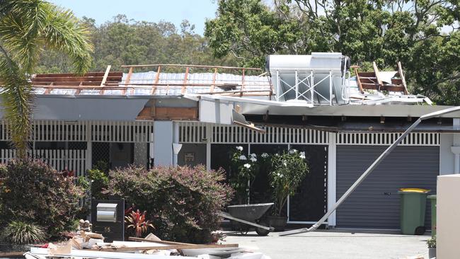 Residents survey the damage at Helensvale caused by wild weather Xmas night. The home of Trish and Bob Avery had its roof ripped off during the storm.. .Picture Glenn Hampson